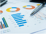 financial reports with pen